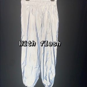 Woman’s street fashion, reflective pants